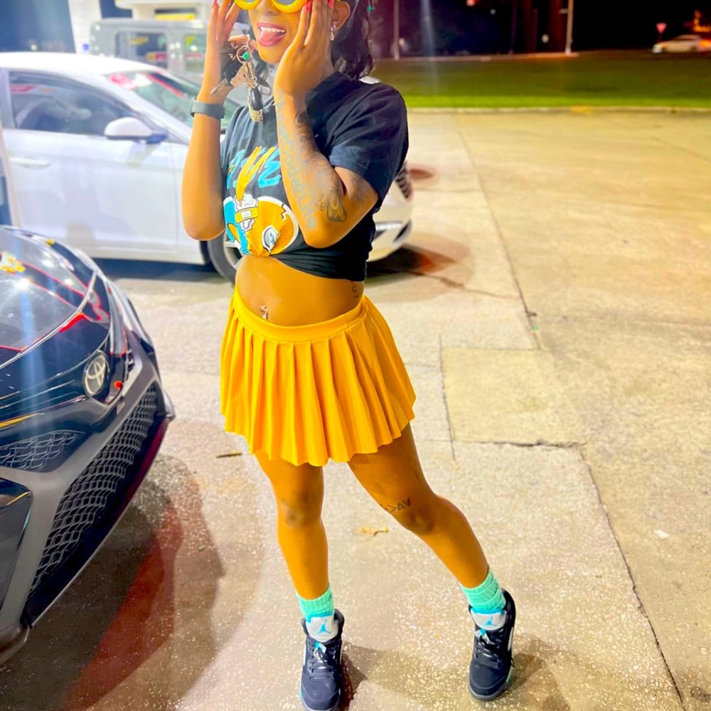 Yellow mini pleated skirt